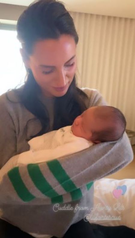 Aunty Lily Fortescue holds little Andrew  for the first time,